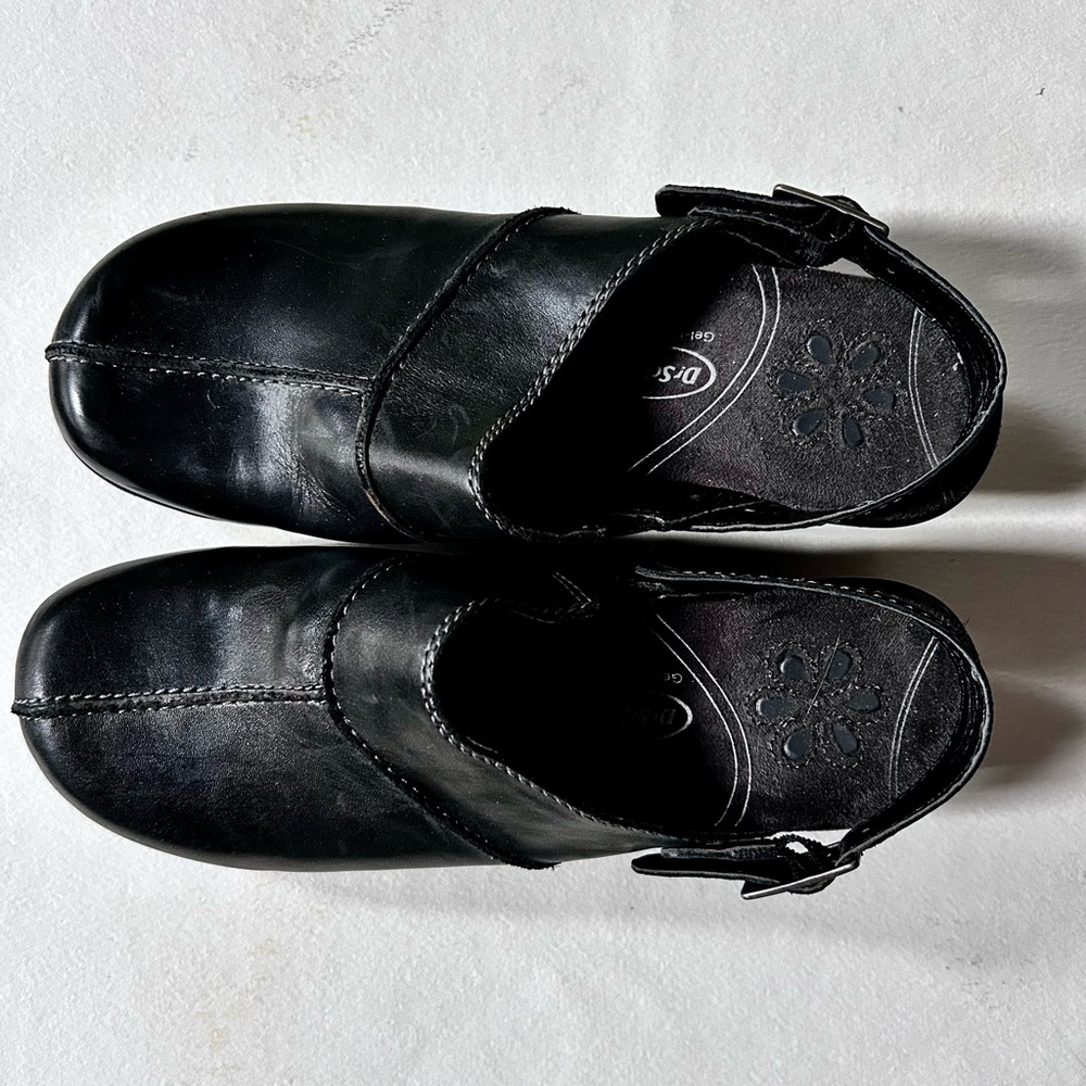 Dr. Scholls black leather clogs.